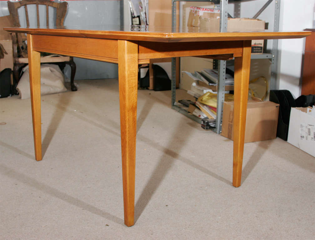 An extending oak dining Table by Gordon Russell of Broadway. at 1stDibs